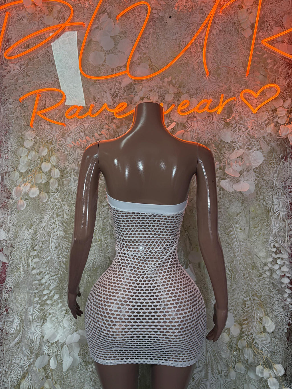 White one-piece fishnet mini dress with back cutout and mesh waistband