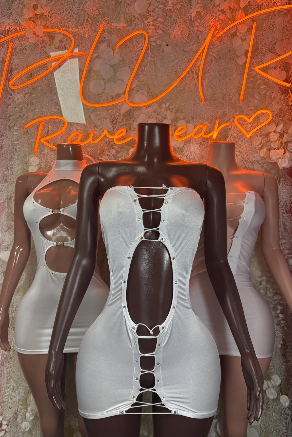 White mini dress with deep halter cutout and corset-lace front eyelets
