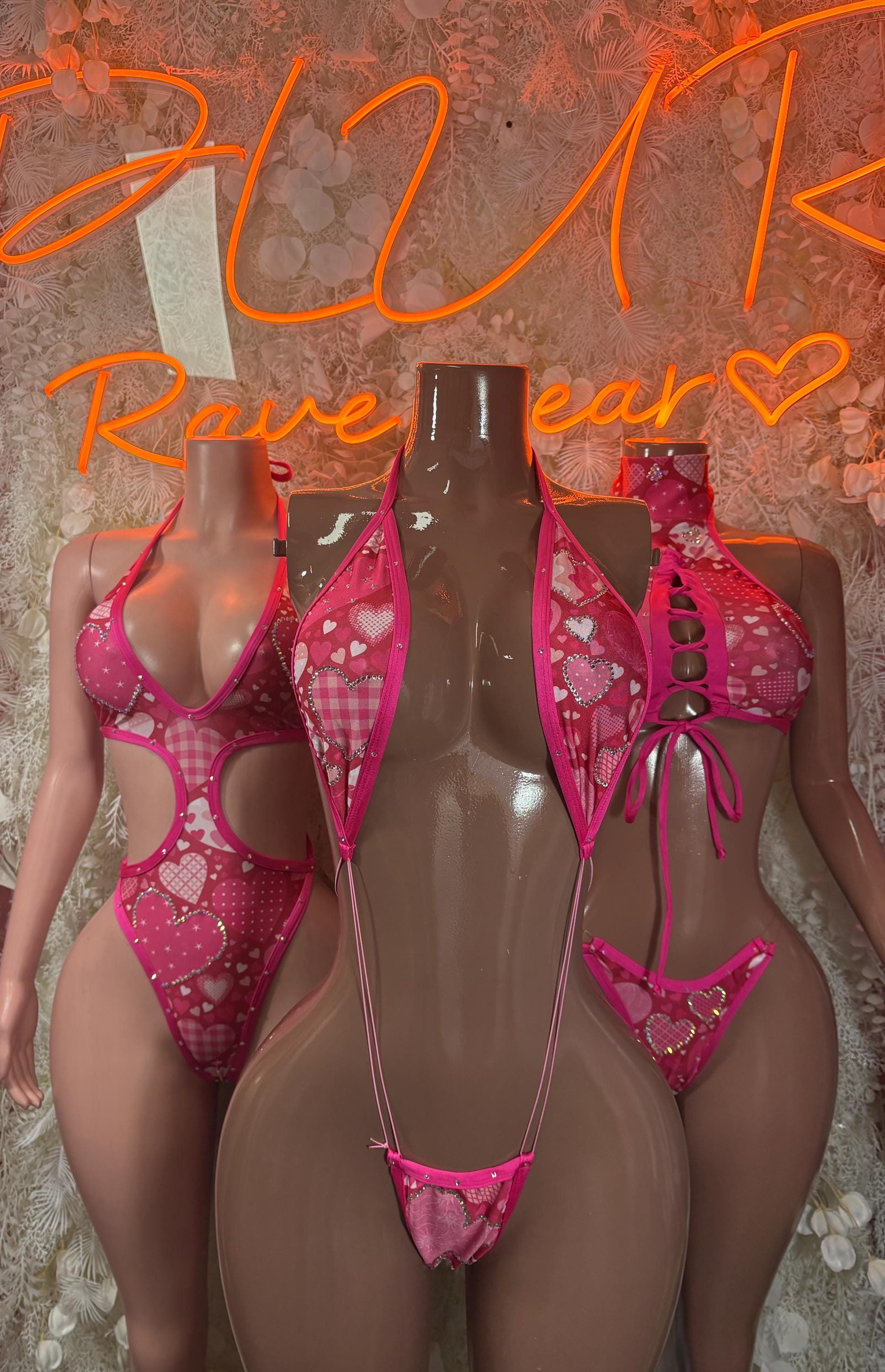 Pink heart-pattern two-piece lingerie set with cutout details and tie straps