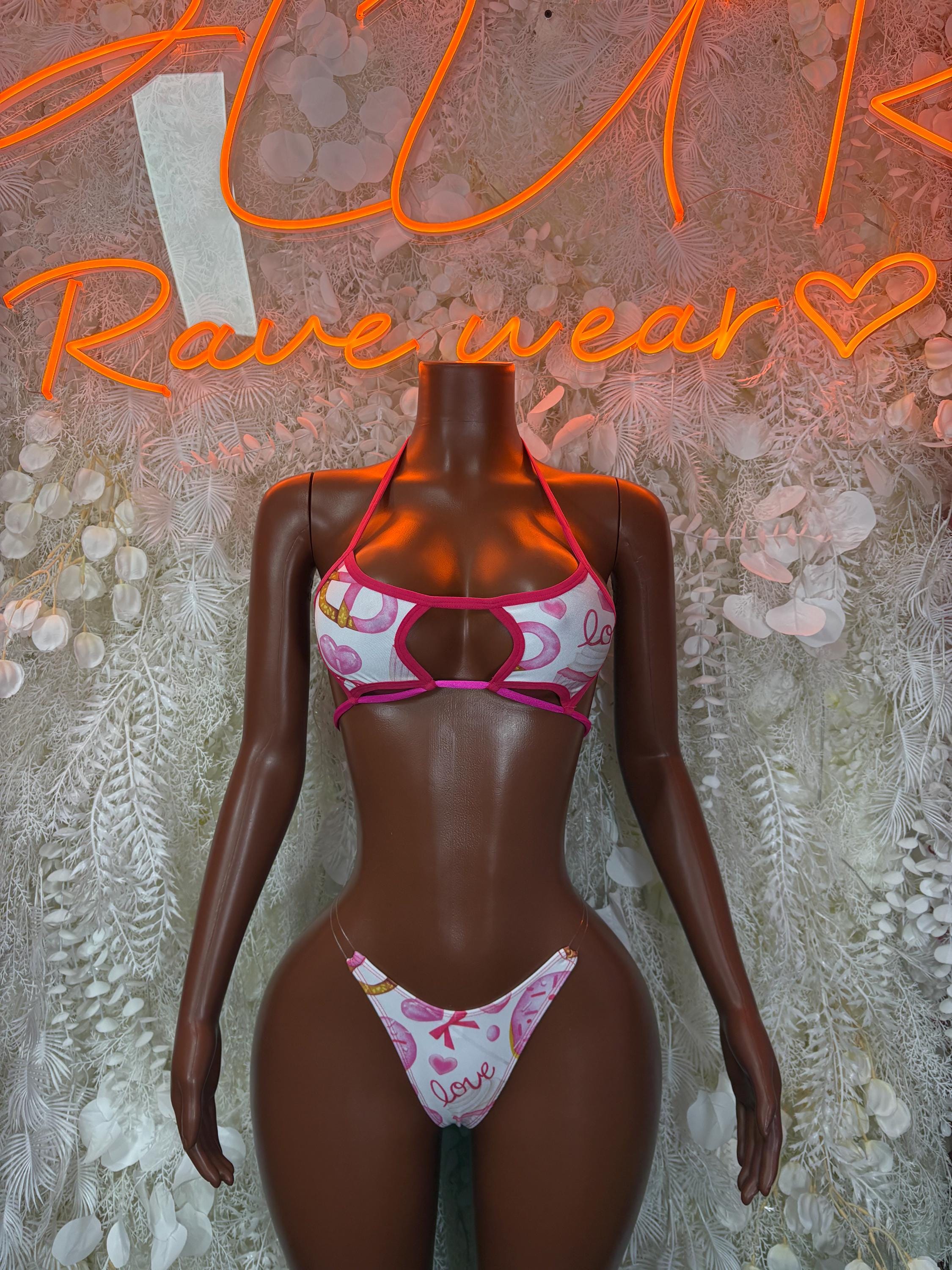 Pink and white lace-up lingerie set with heart pattern, underwire bra and matching thong