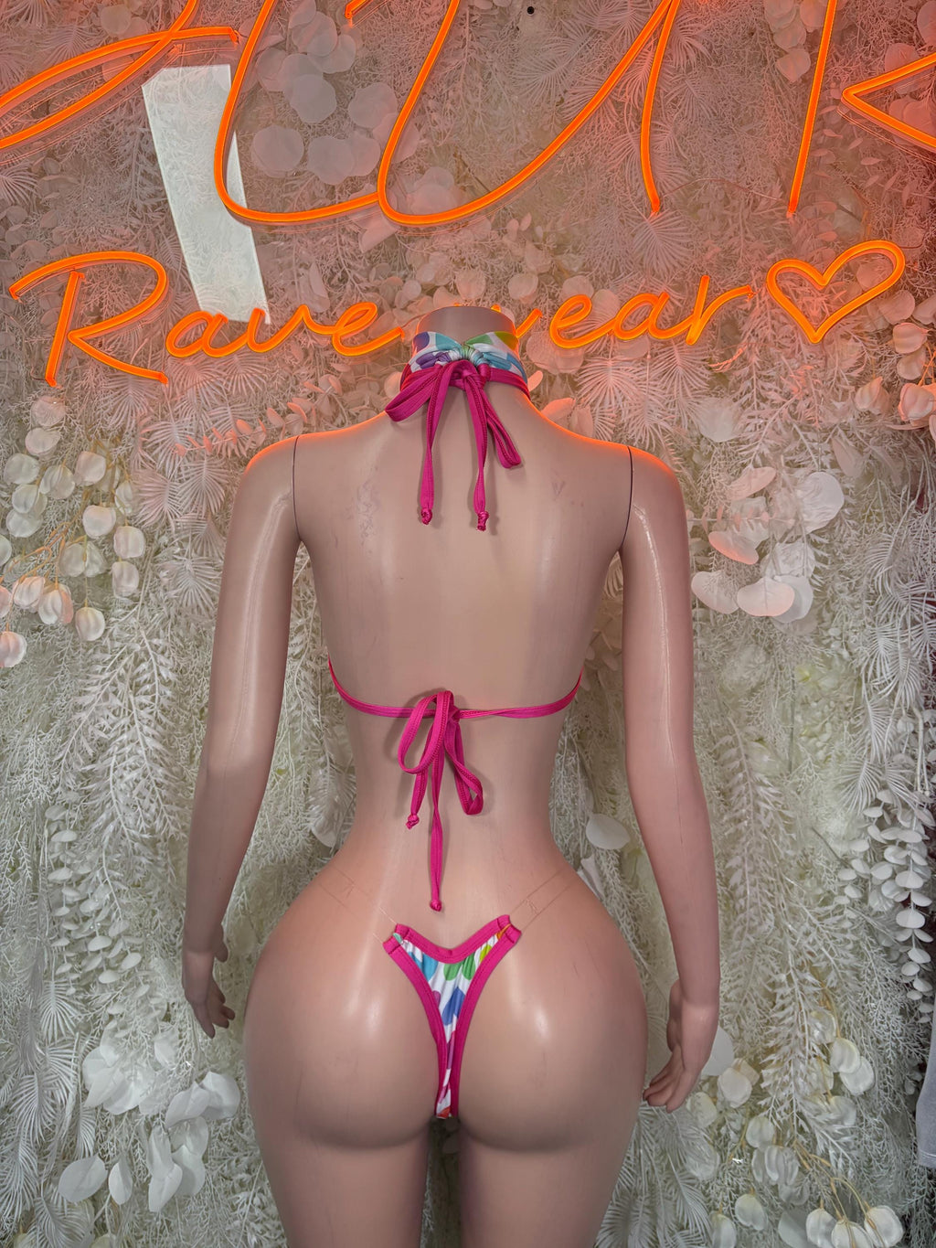 Heart print lingerie set back view: halter top ties and heart thong bottom with pink laces
