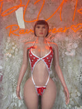Red heart-print lingerie bodysuit with white trim and lace-up straps