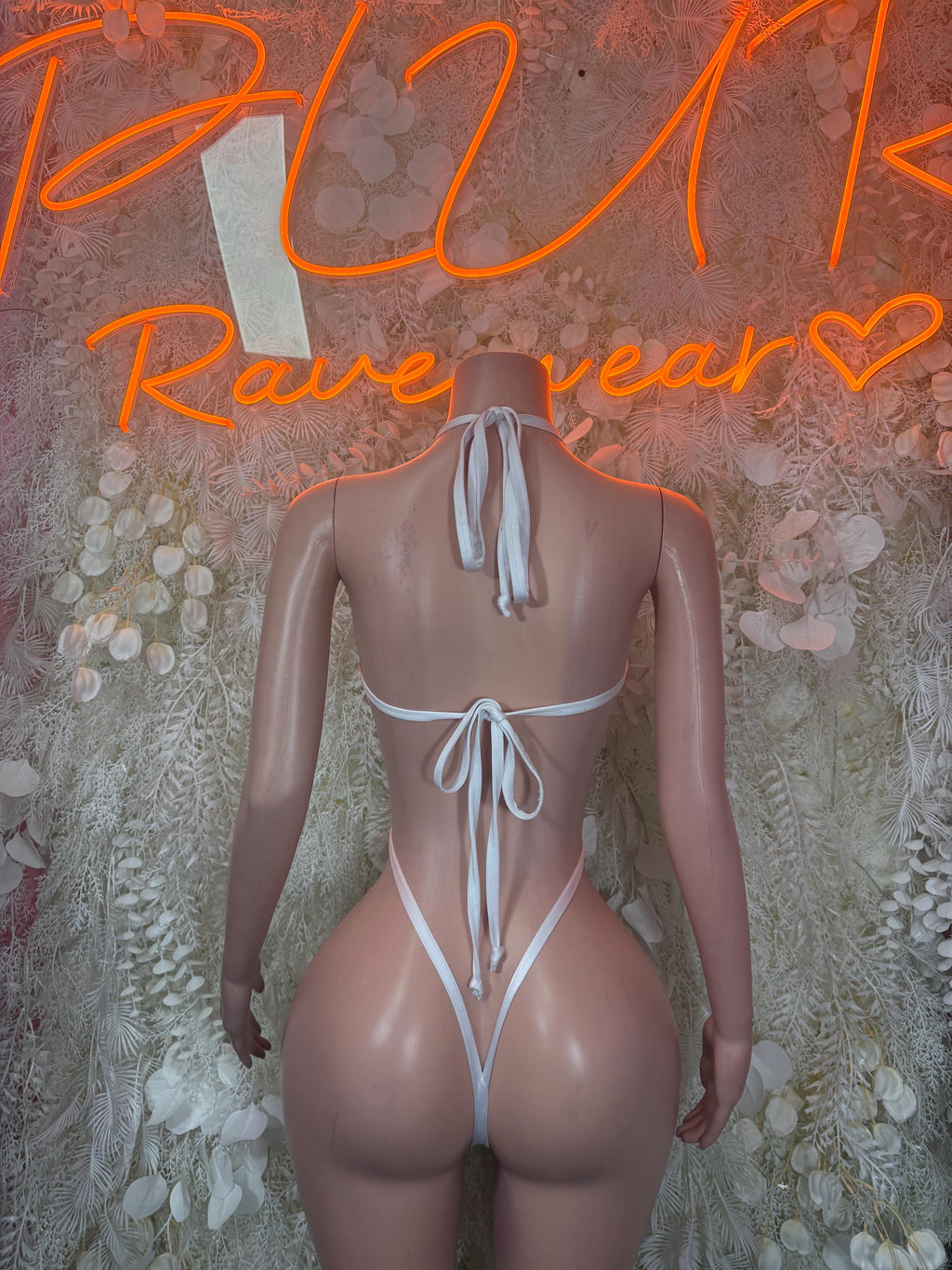 Heart lingerie bodysuit back view with red print, white straps and ribbon ties