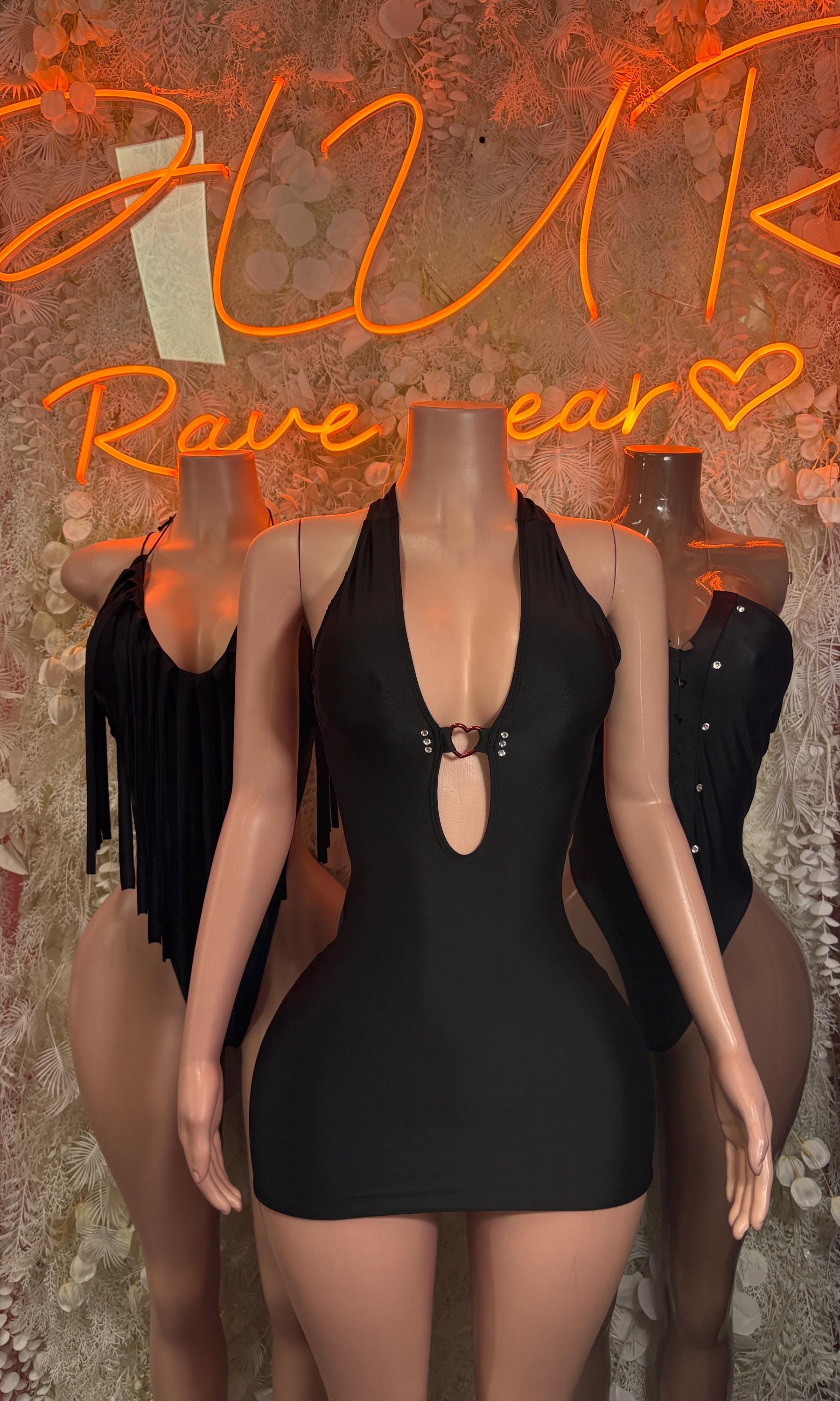 Black dancewear mini dress with V neckline and teardrop chest cutout with ring