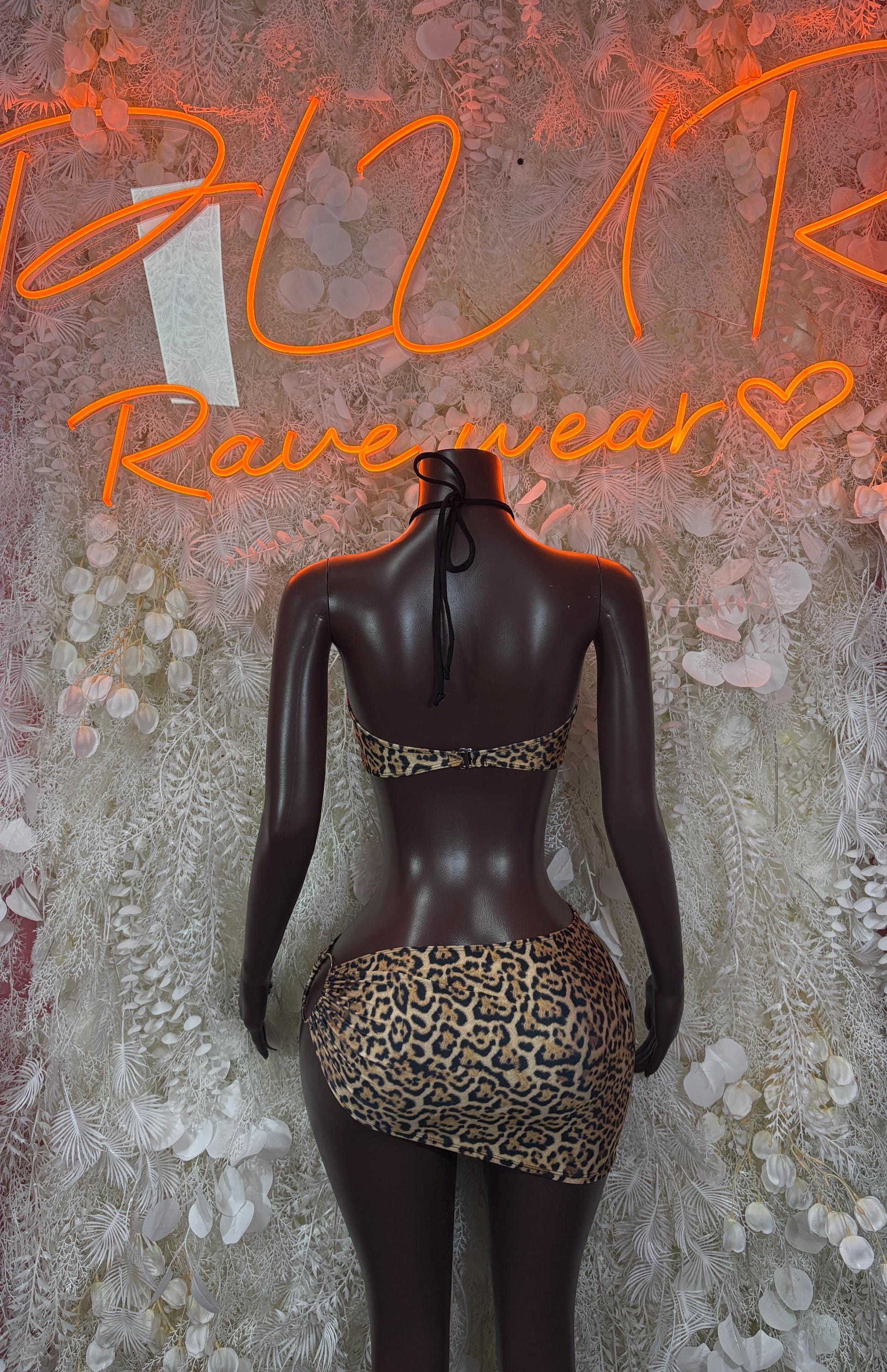 Leopard print mini skirt with black backing detail, high-waisted, rear view