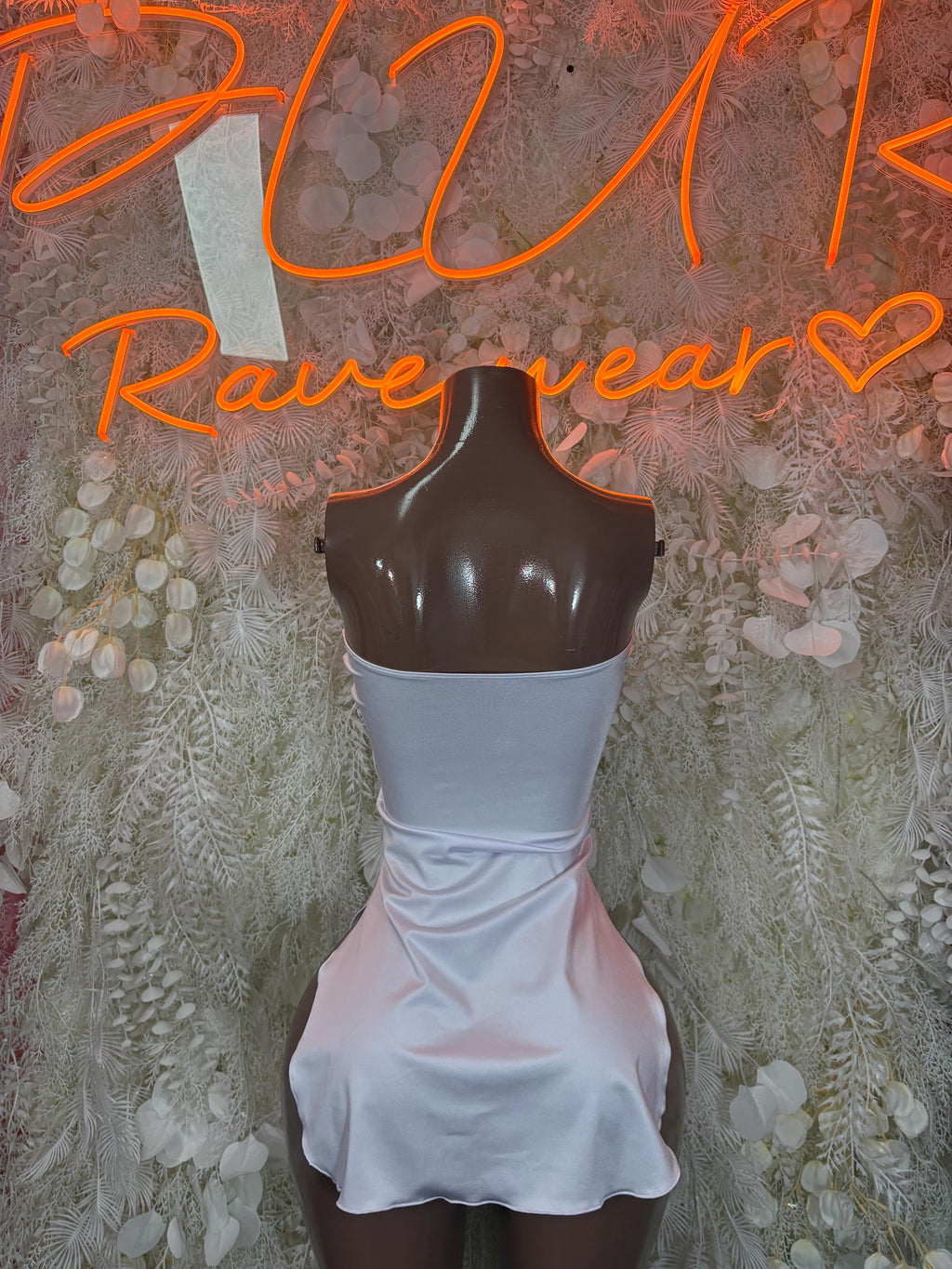 White sleeveless satin mini dress with high back and fitted ruched skirt