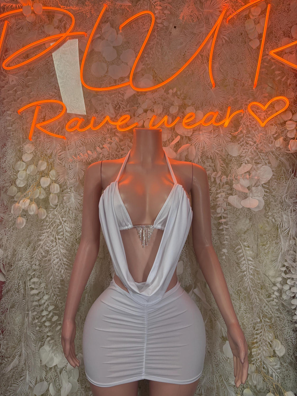 White bodycon mini dress with cowl neckline and ruched sides