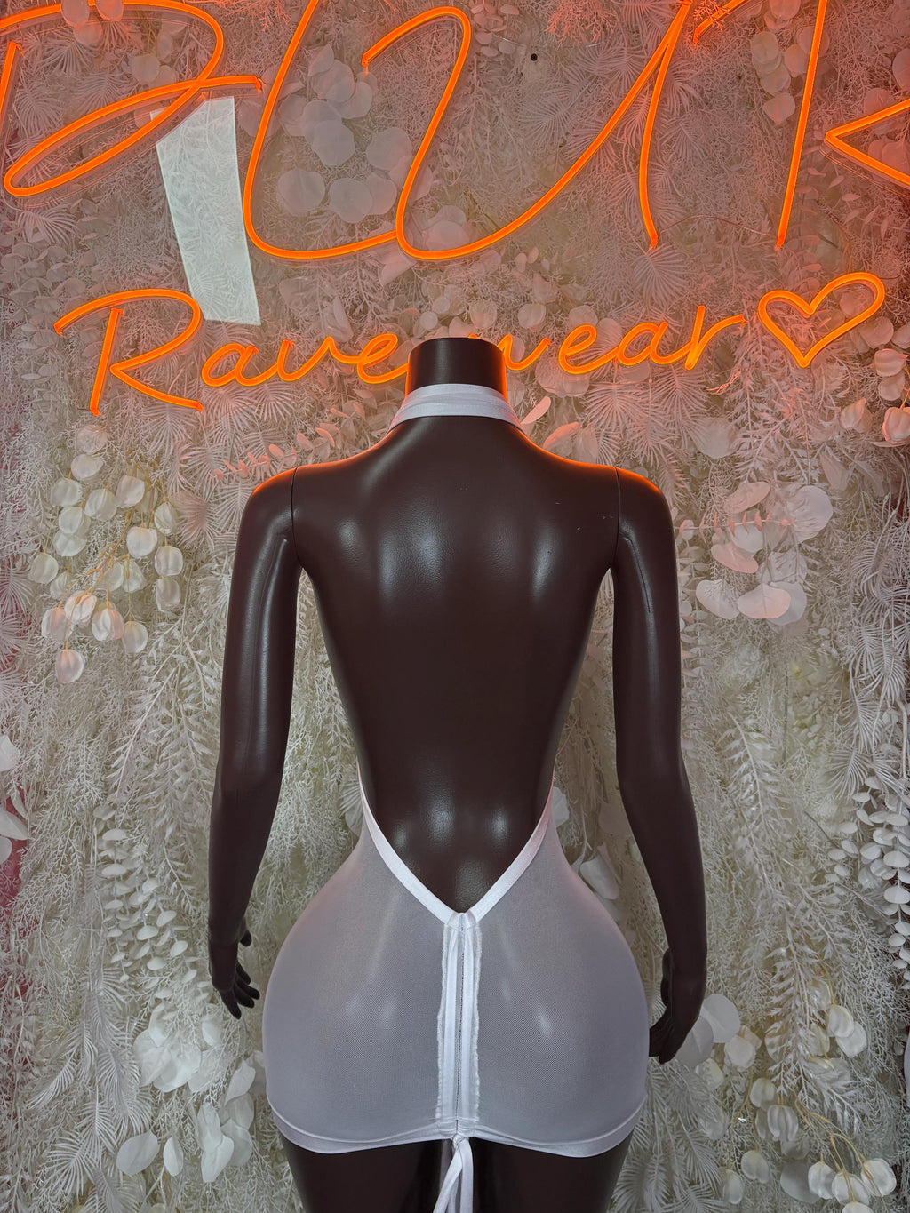 White mesh mini dress with open back and center tie detail, fitted silhouette