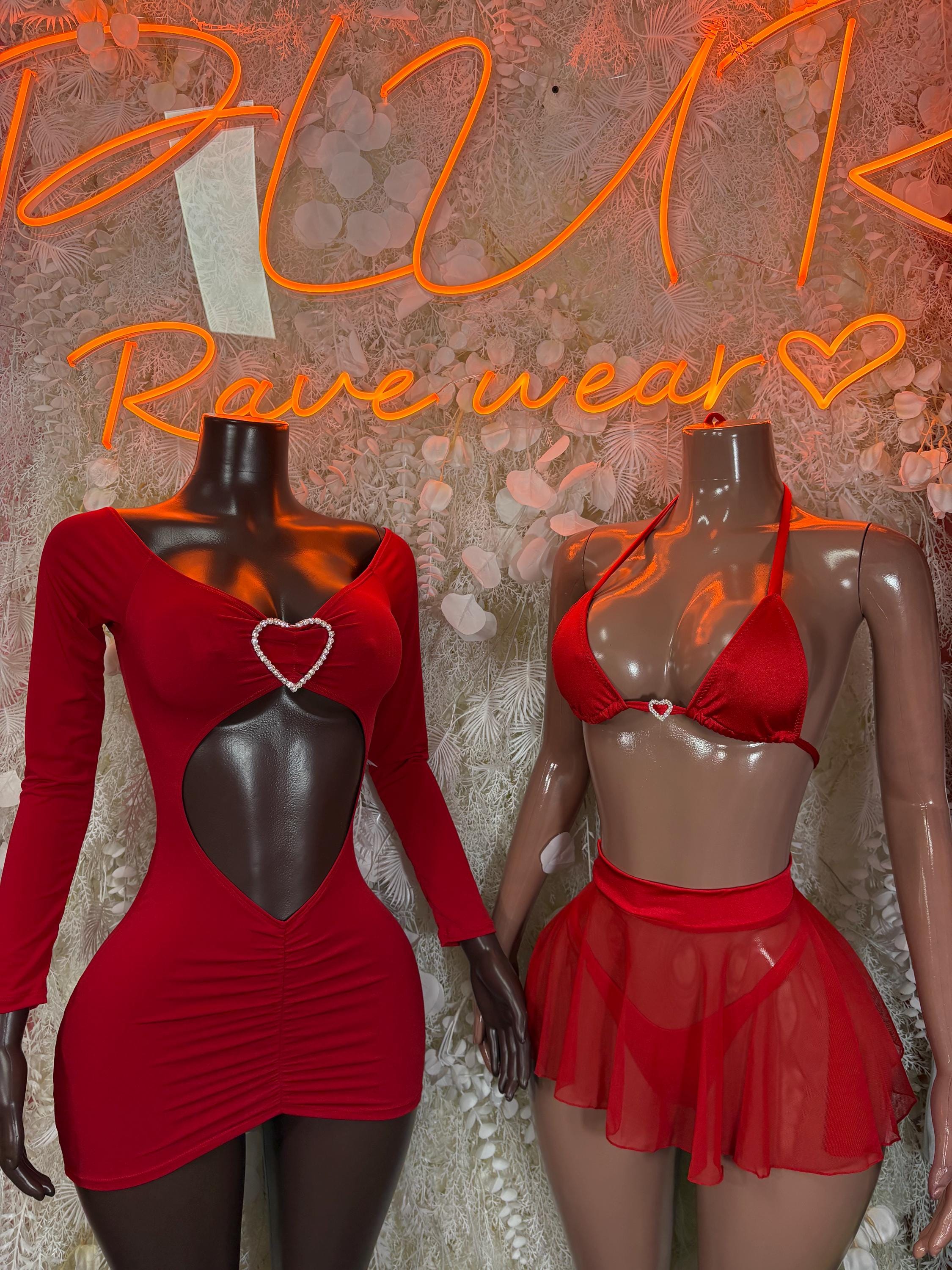 Red long-sleeve mini dress and red bra-and-tulle skirt lingerie on mannequins