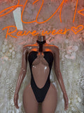 Black one-piece bodysuit with plunging neckline and central keyhole cutout.