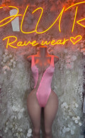 Pink sleeveless thong bodysuit with lace front detail, shown on a mannequin