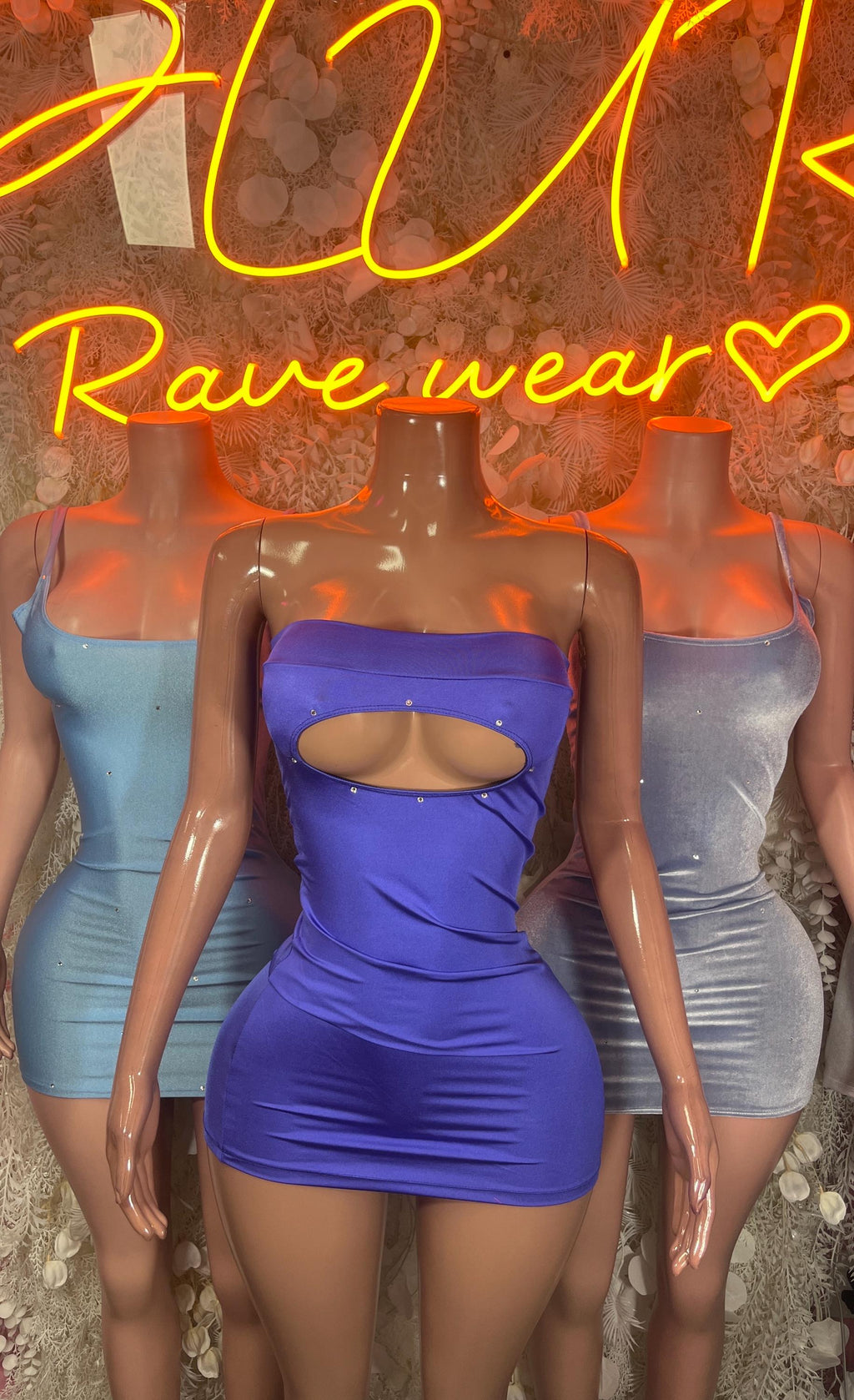 Purple strapless velvet mini dress with chest cutout; blue sleeveless mini dress
