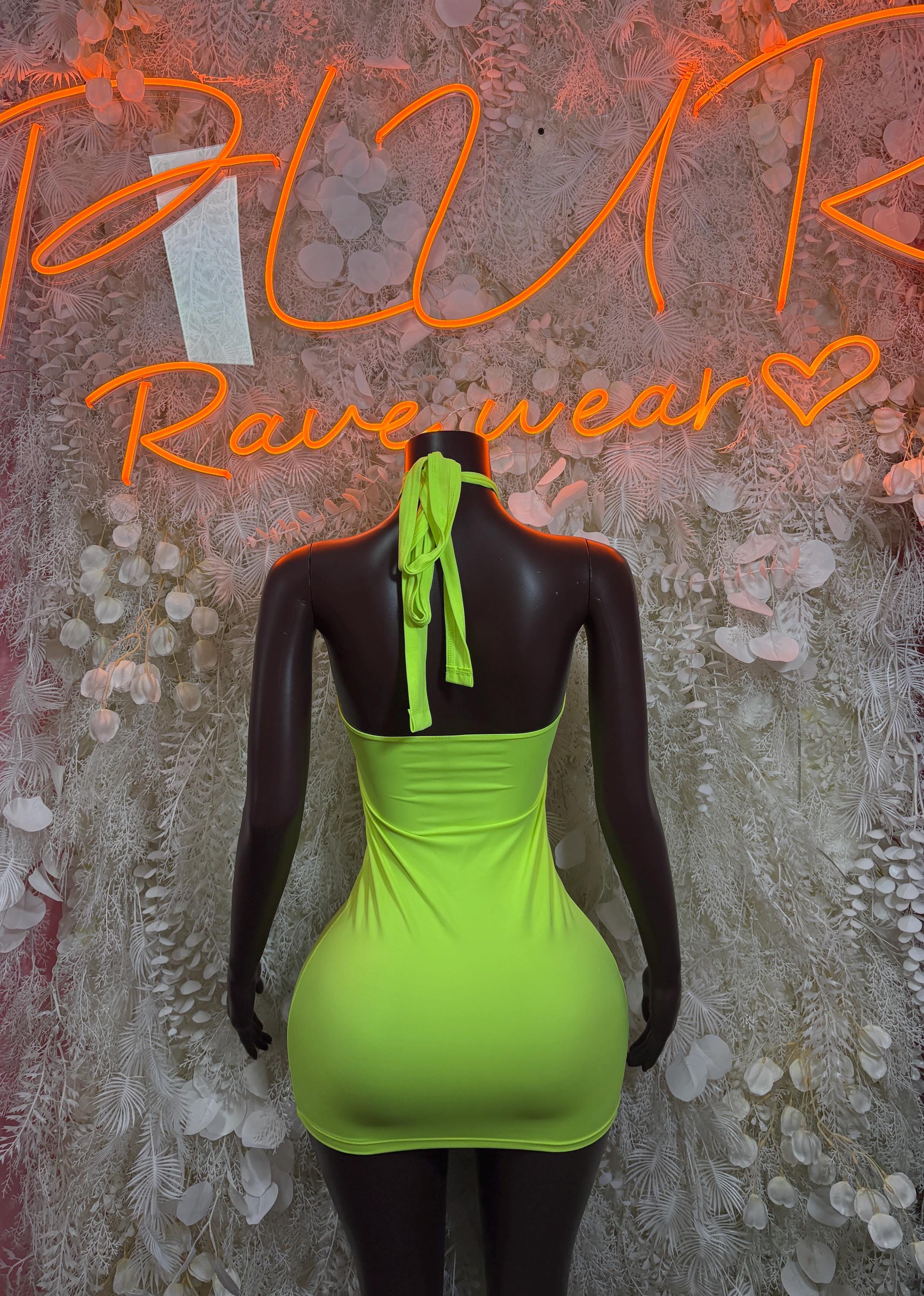 Shiny neon green sleeveless festival dress with open back and tie strap