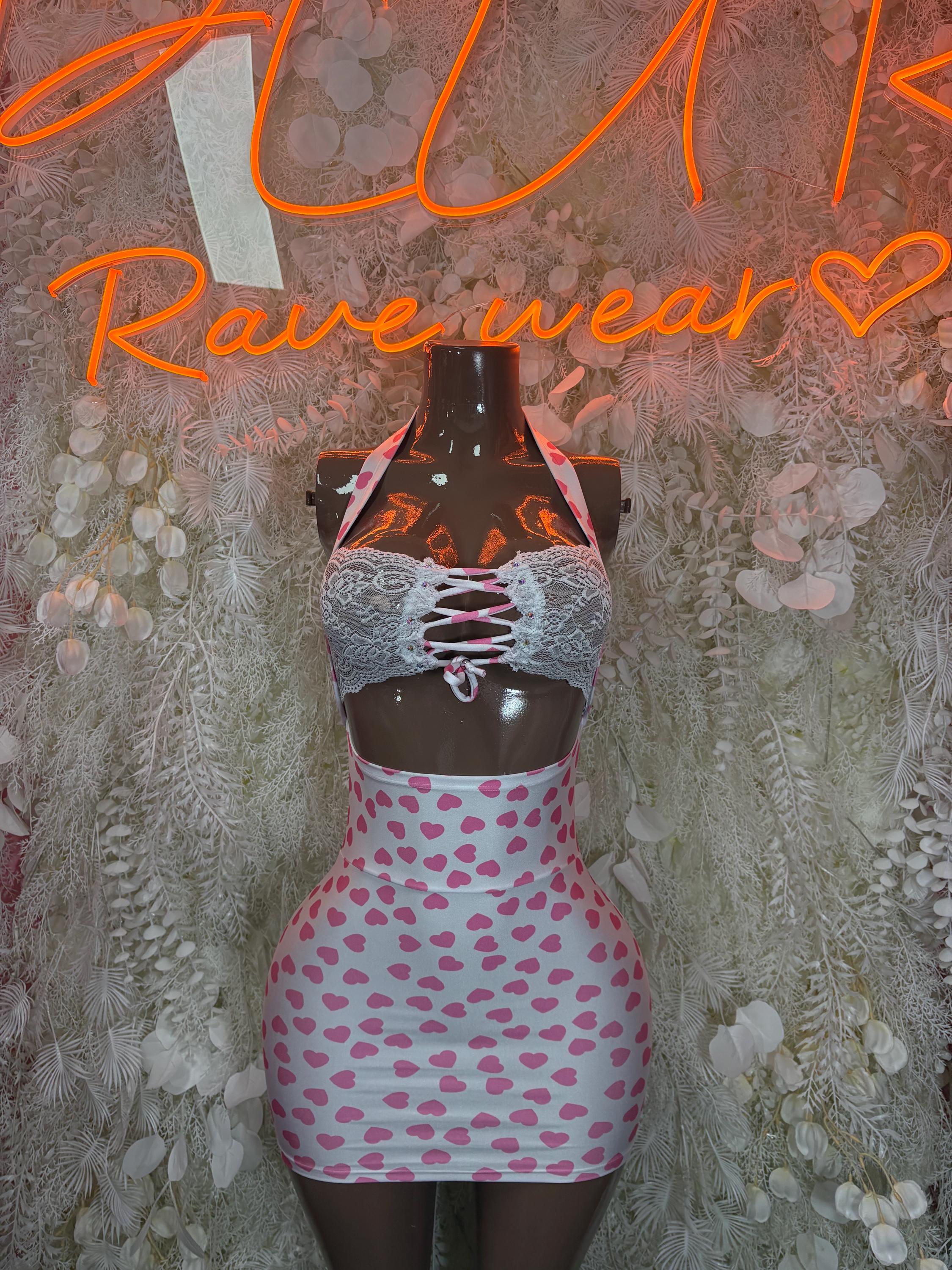 Pink heart mini dress with lace-up black bodice and short heart-pattern skirt
