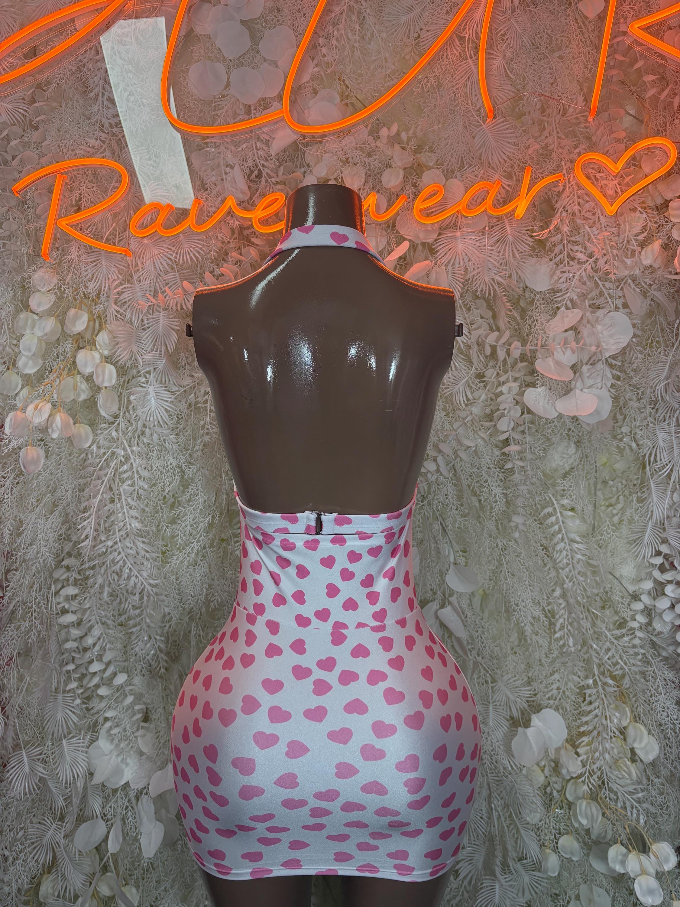 Pink heart mini dress with black backless bodice and fitted heart-pattern skirt