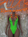 Neon green festival bodysuit with halter straps and lace-up front panel