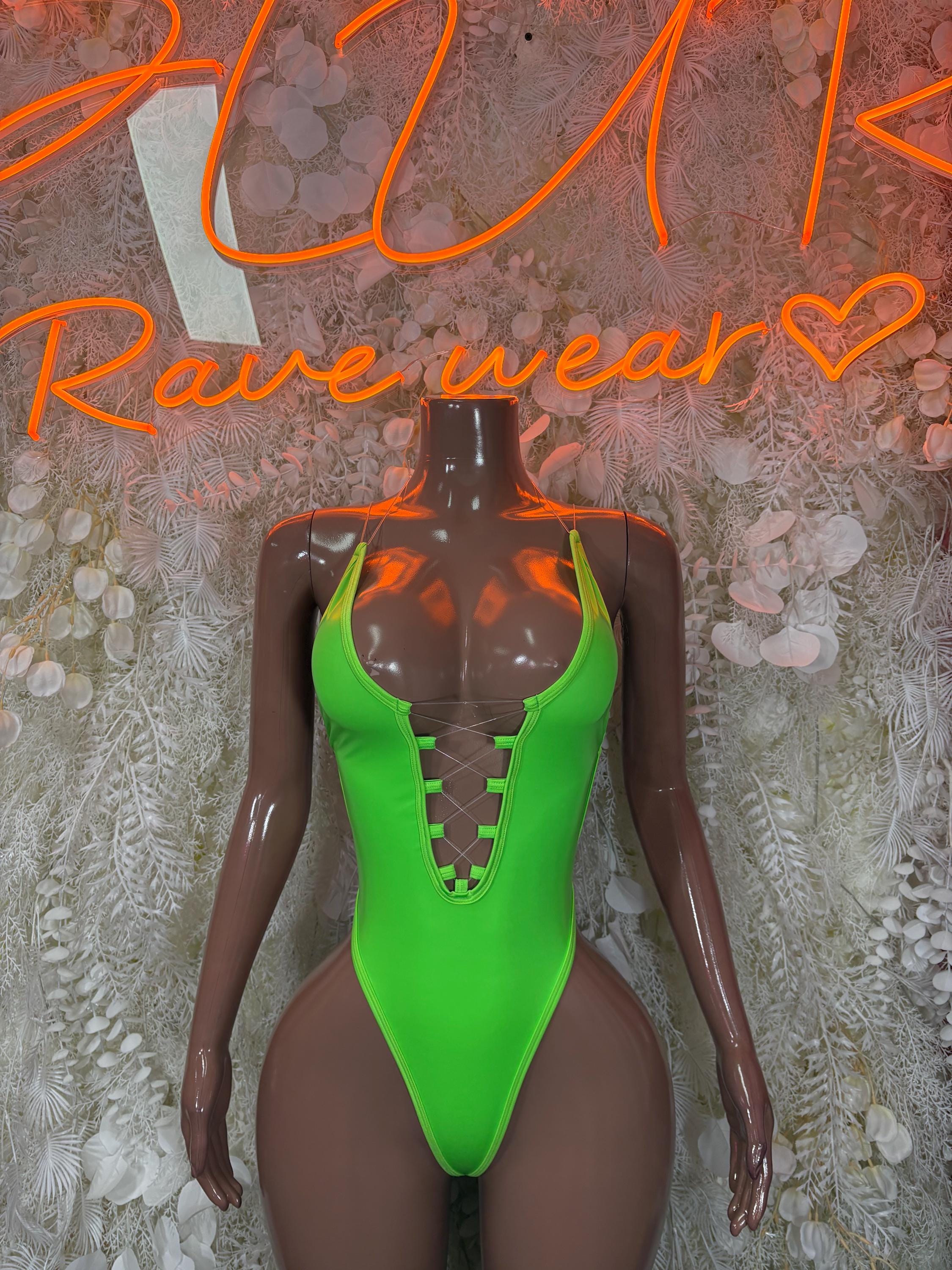 Neon green festival bodysuit with halter straps and lace-up front panel
