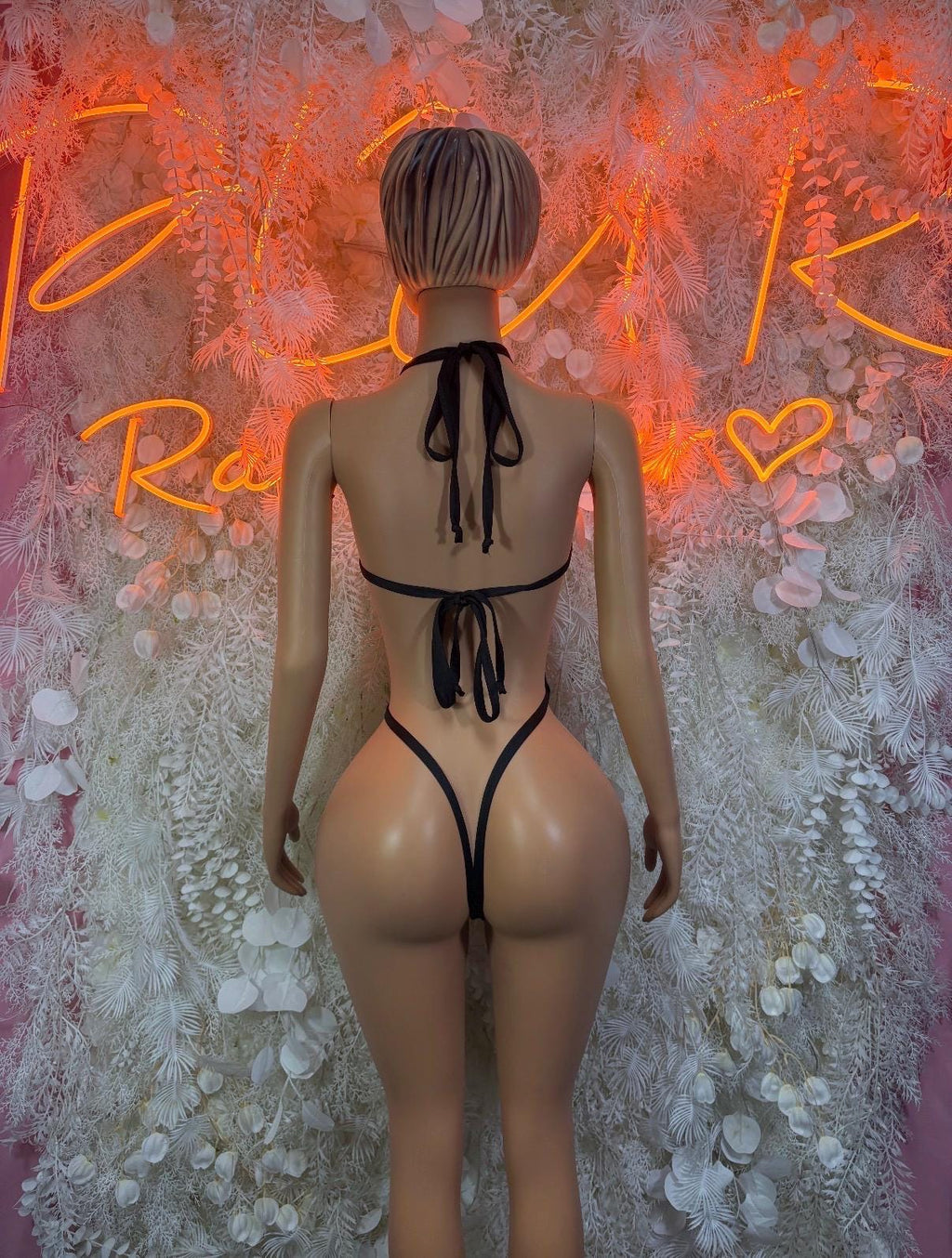 Back view heart-print lingerie bodysuit with black tie straps and open back