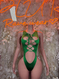 Green lace-up bodysuit with crisscross front and teardrop cutout
