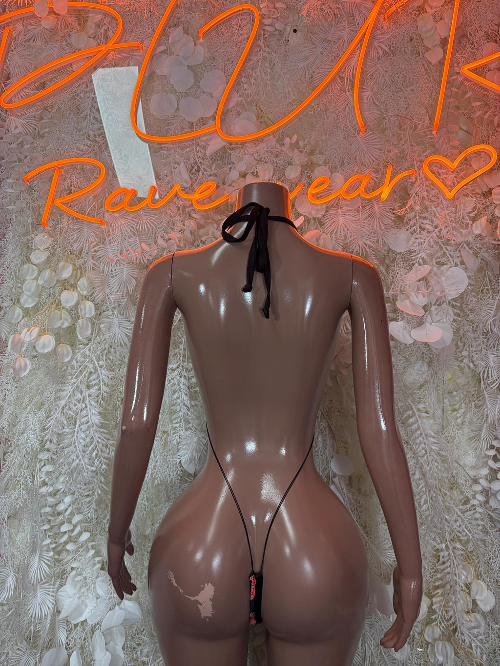 Black sheer lingerie bodysuit with lace-up back tie and red kiss print