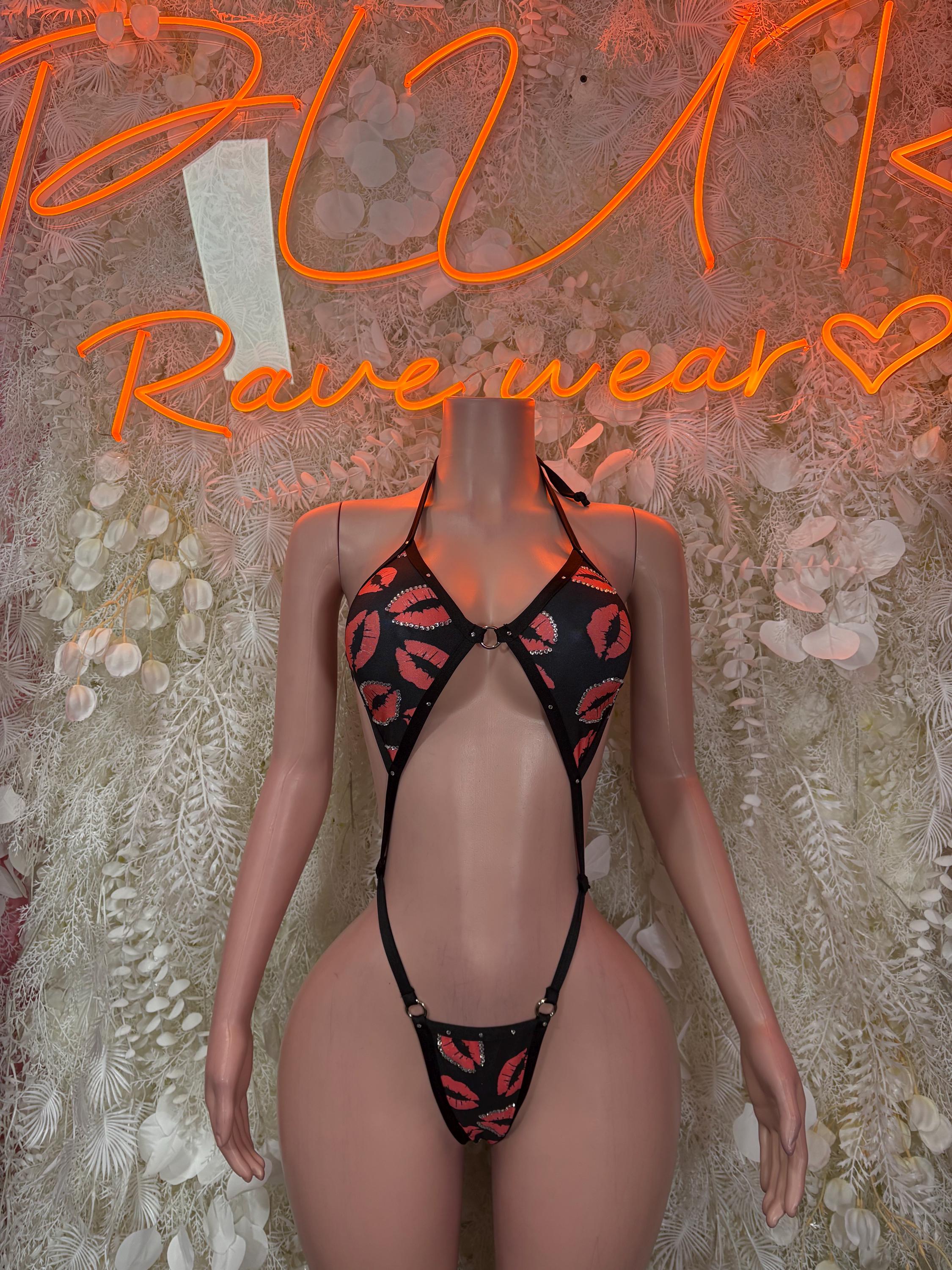 Black heart-pattern lingerie set with halter straps and thong cutout front