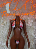Heart print one-piece swimsuit with black lace-up V neckline and cheeky cut