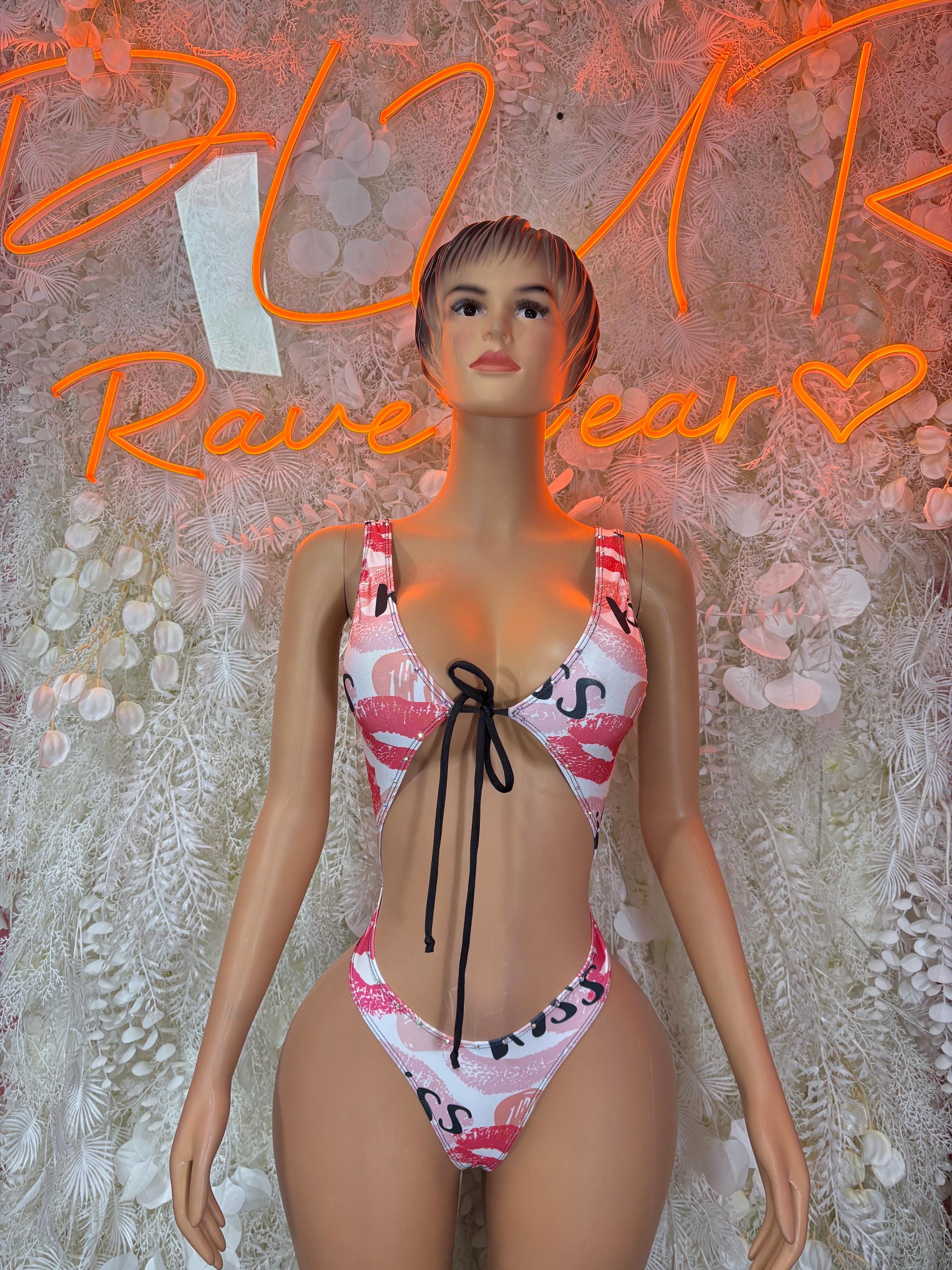 Heart print one-piece swimsuit with pink-red cups, black tie at center, thin straps