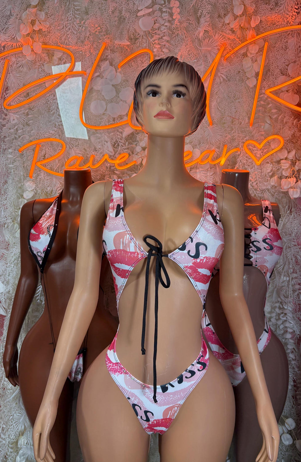 Heart print one-piece swimsuit with V-neck, black center tie, pink-red hearts on white