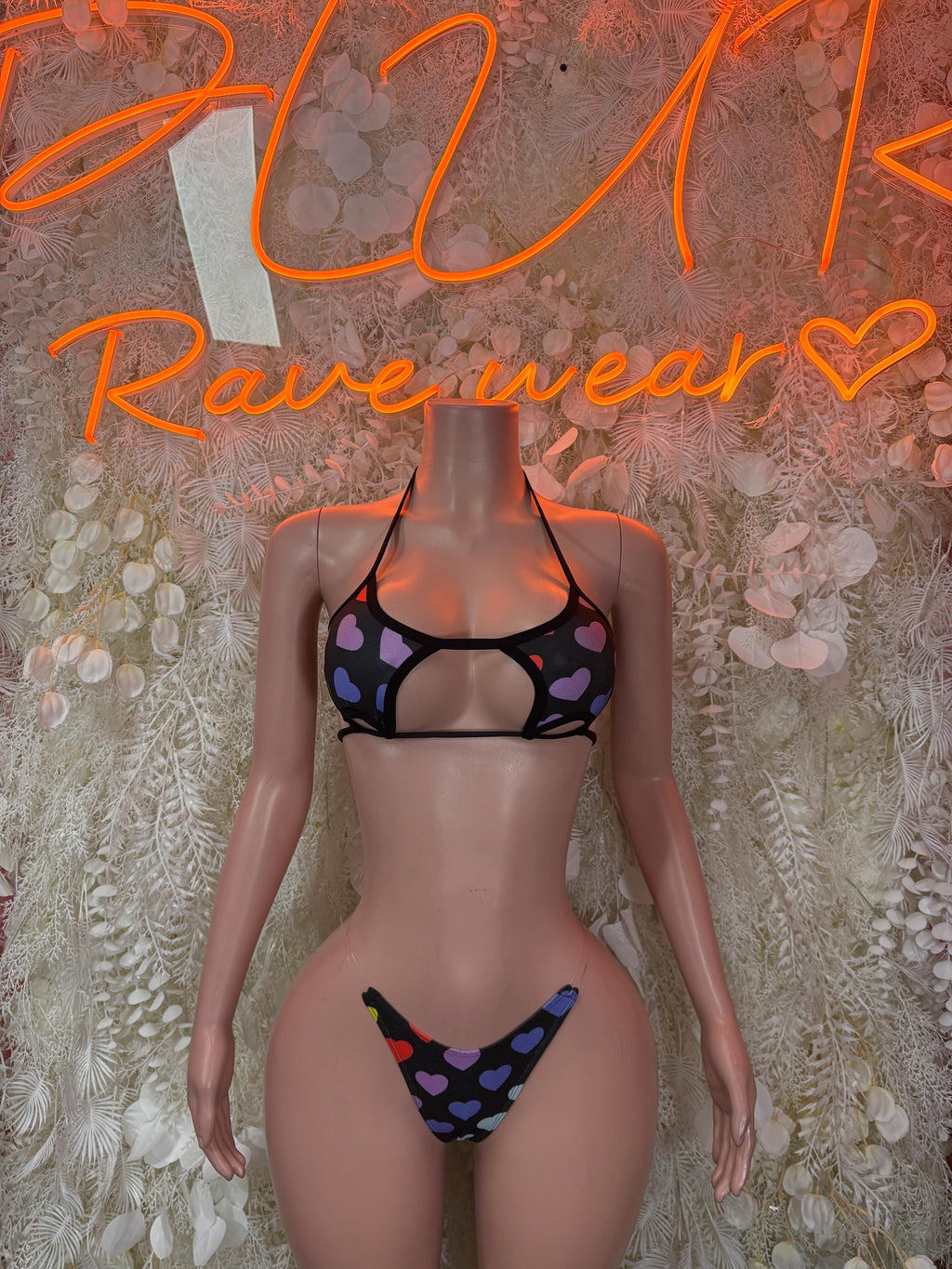 Heart-print black lingerie set with triangle bra and matching thong, adjustable straps