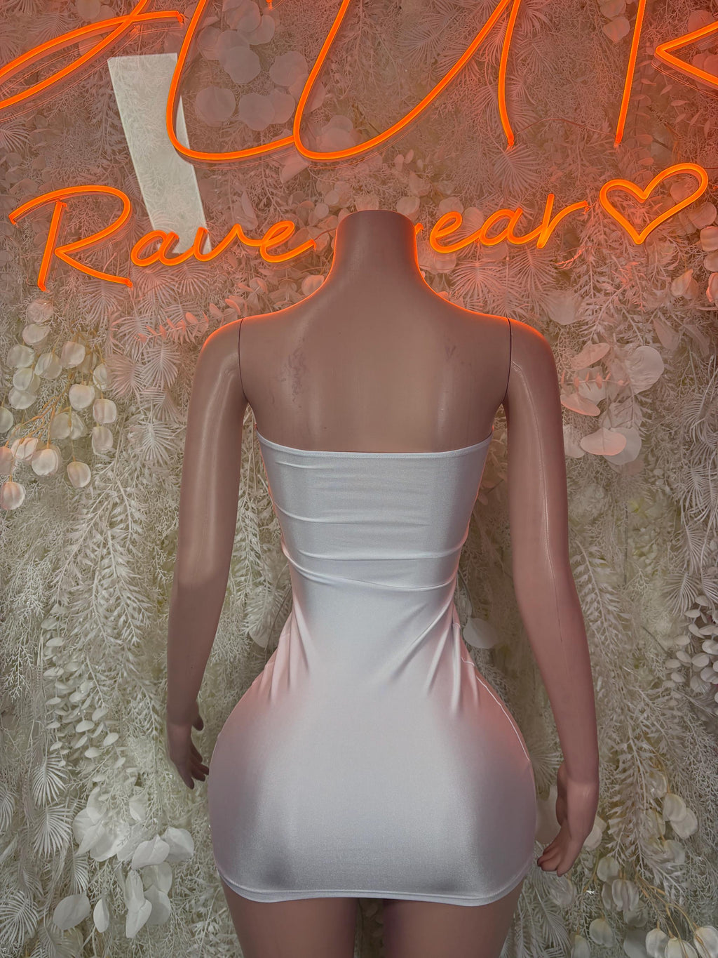 White ruched mini dress with open back and corset-style center shaping
