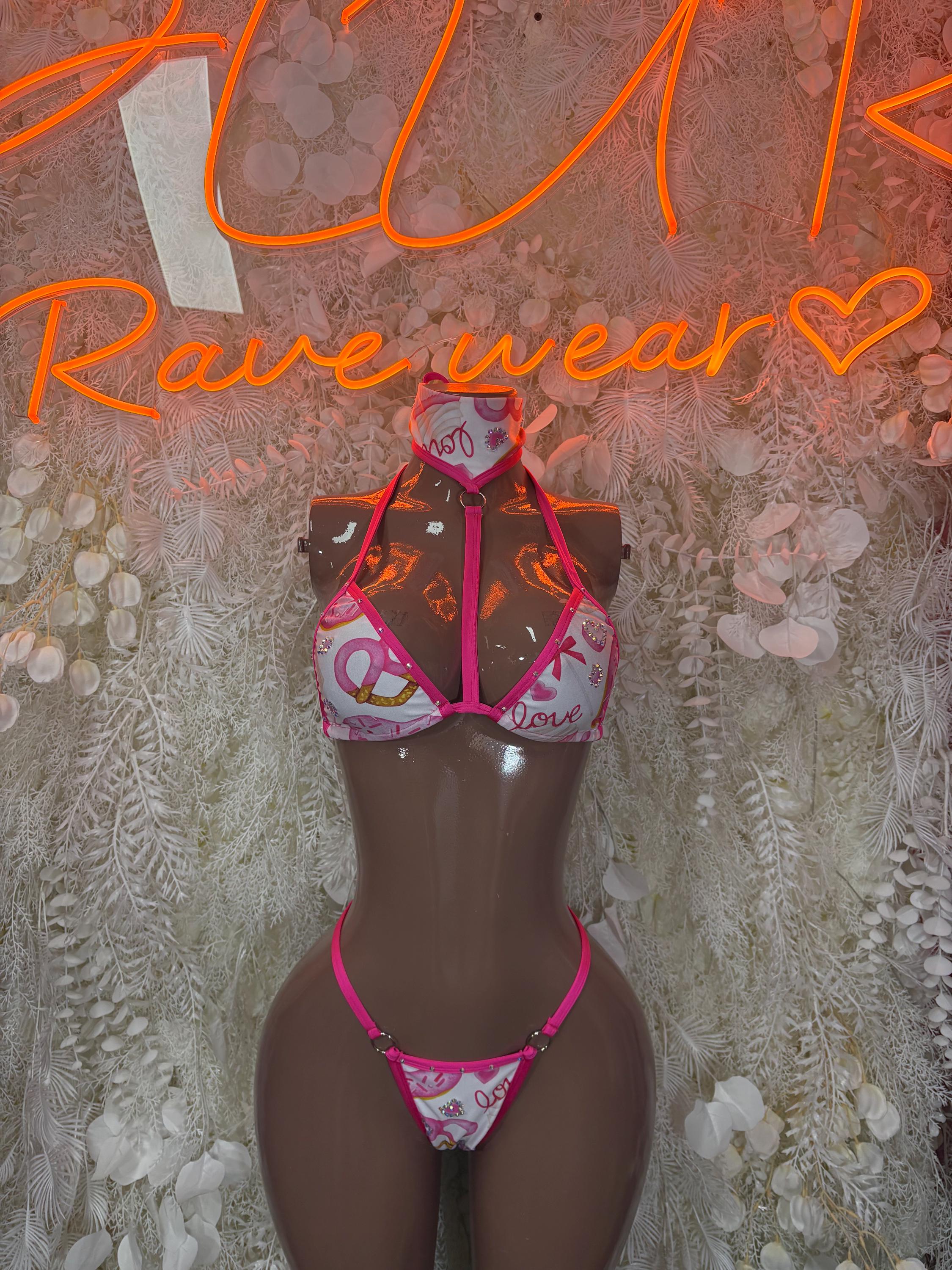 Pink-and-black patterned two-piece bikini with tie-front top and thong bottoms