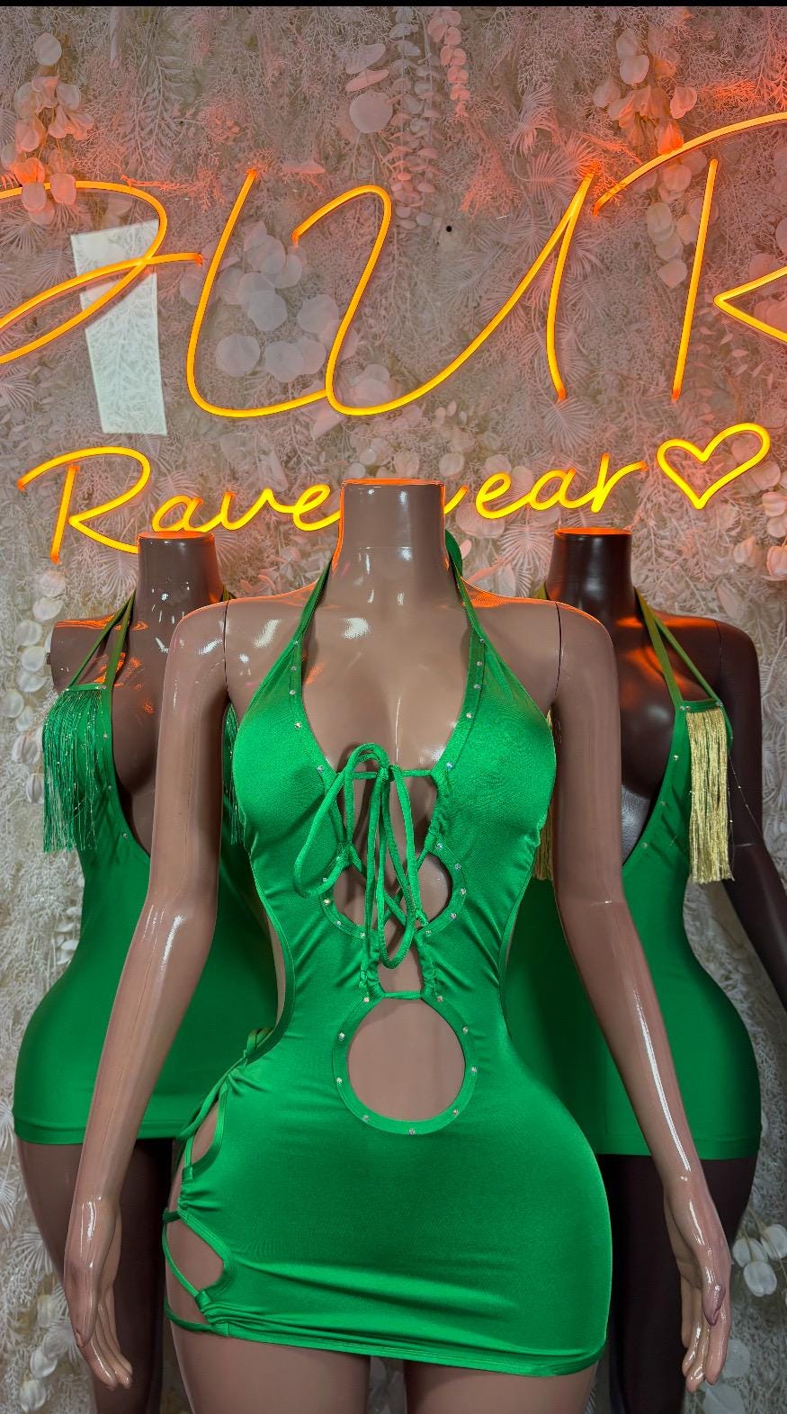 Green mini bodysuit dress with lace-up front and circular chest cutout