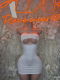 White strapless bodycon mini dress with ruched sides and oval chest cutout