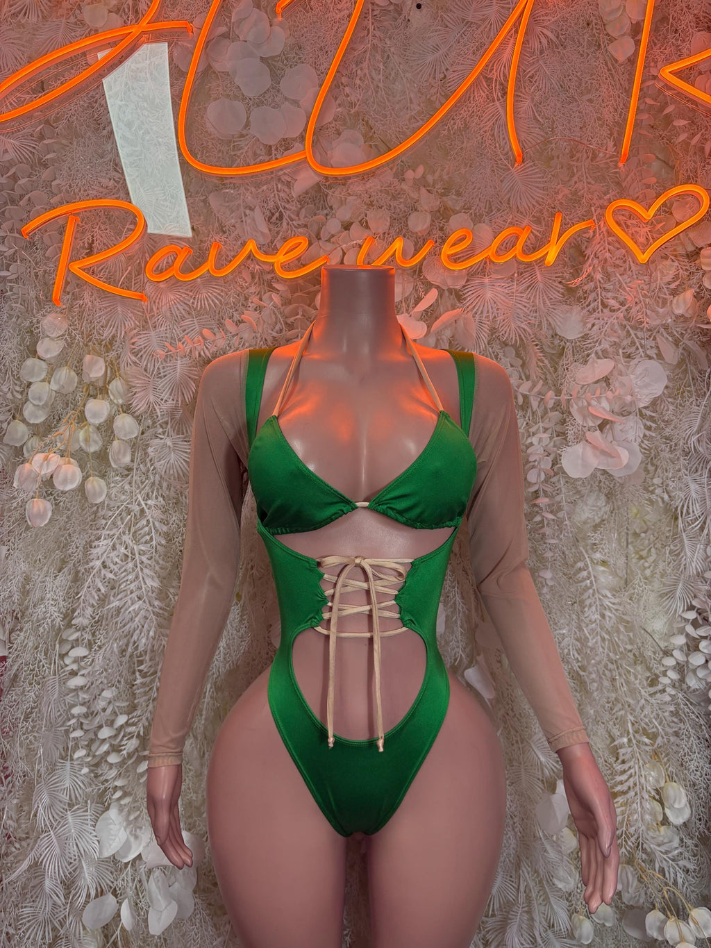 Green strappy lace-up bodysuit with triangle cups and sheer long sleeves