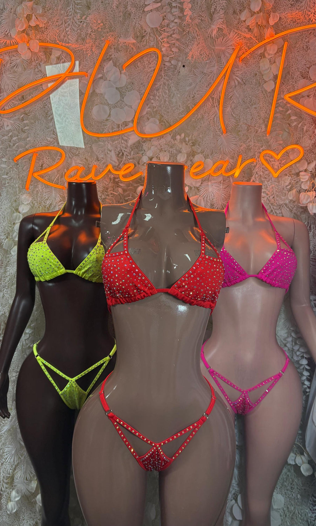 Rhinestone bikini sets in neon yellow, red, and pink on mannequins