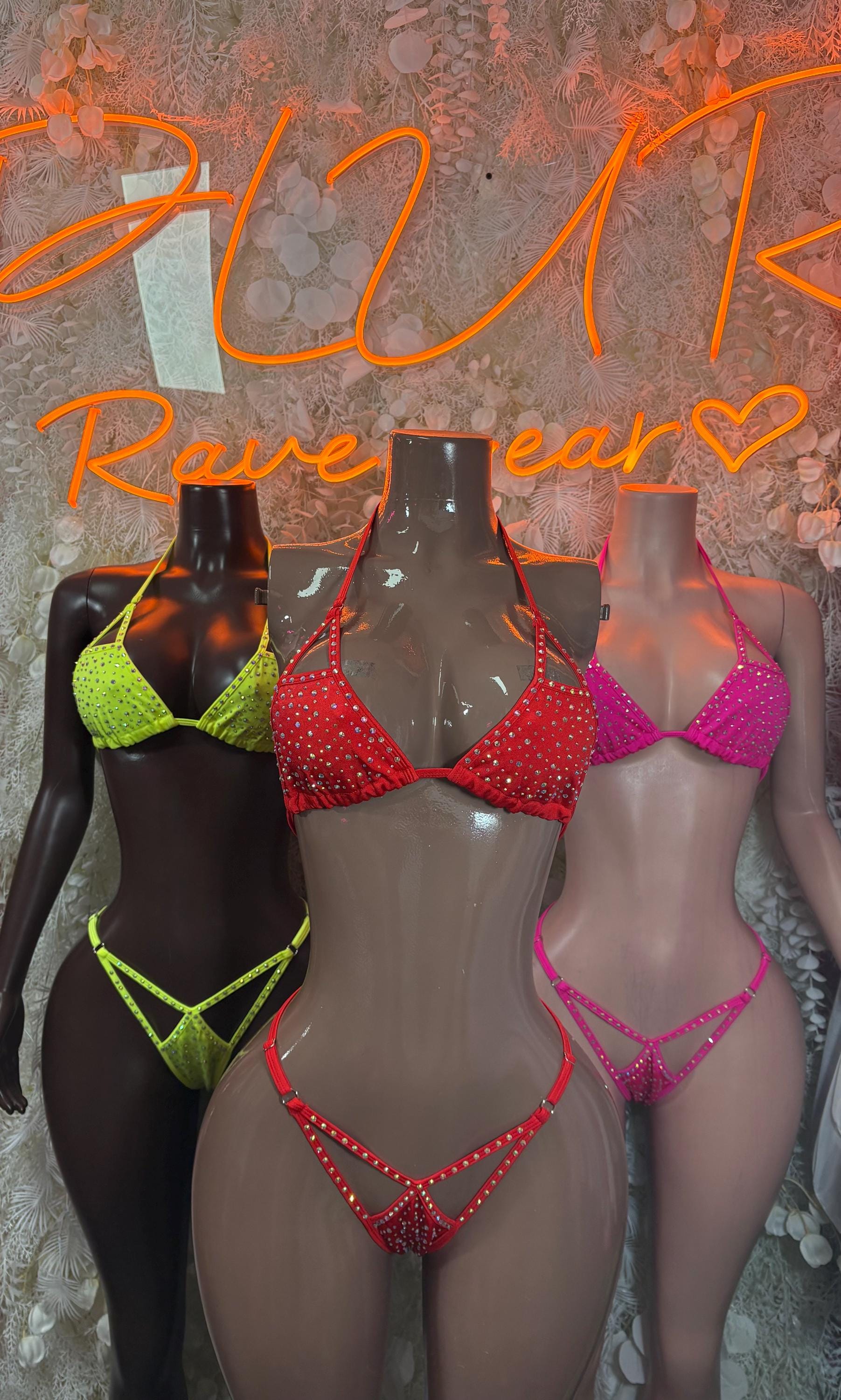 Rhinestone bikini sets in neon yellow, red, and pink on mannequins