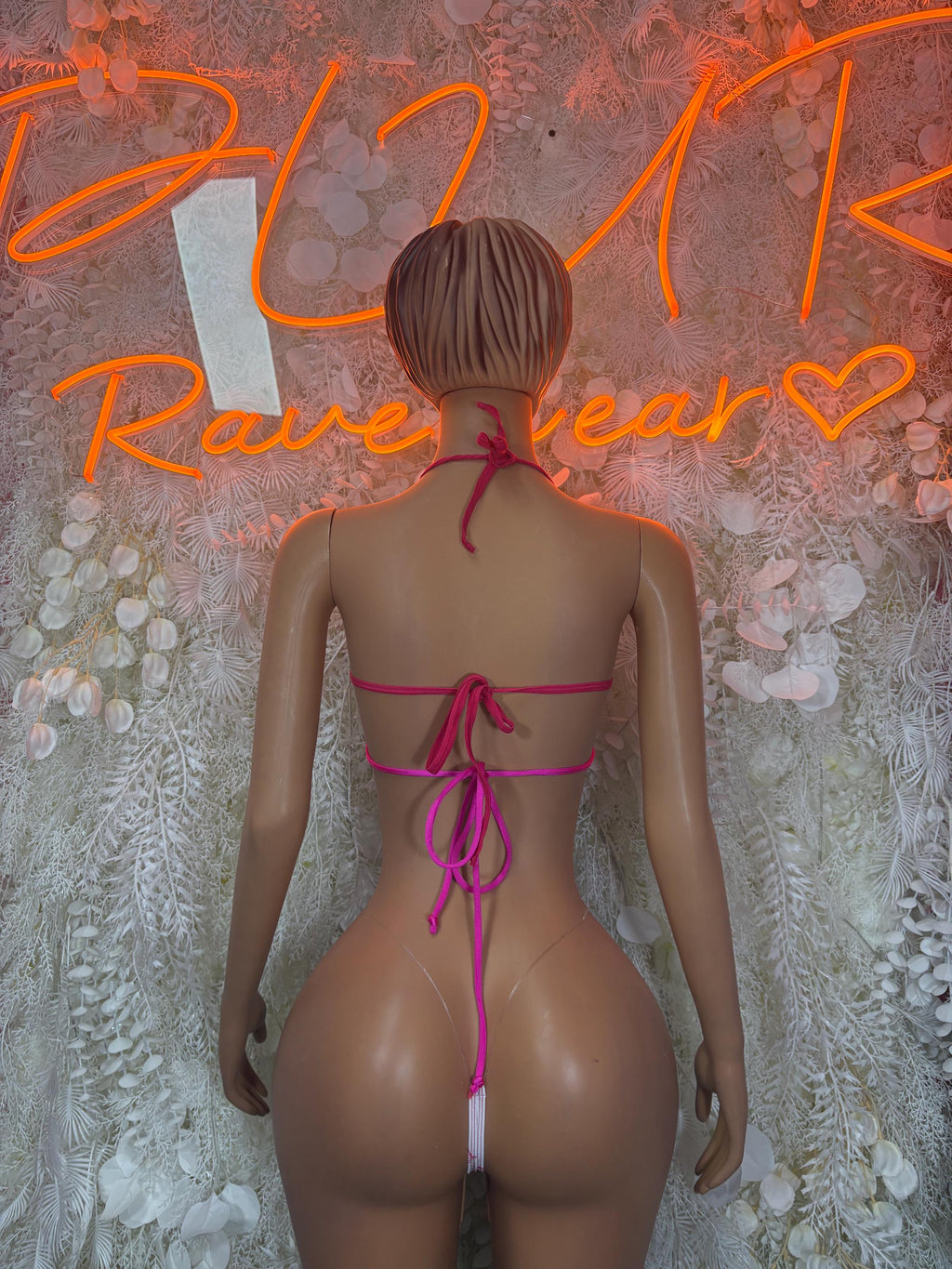 Pink-and-white bikini set back view with triangle top and tie-side bottoms