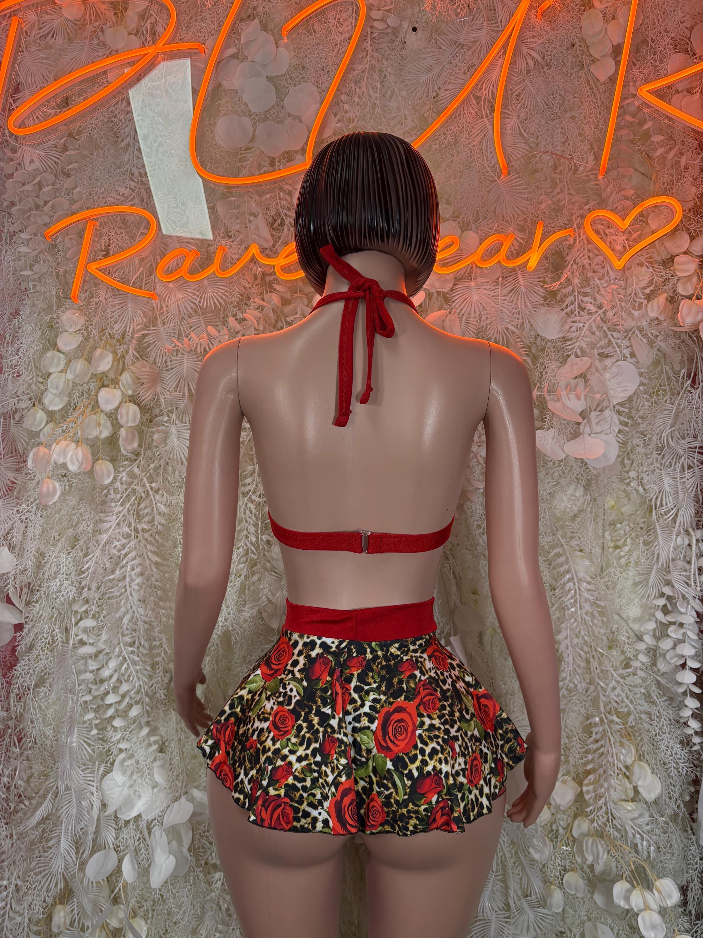 Floral skirt set shown from back with halter tie and rose-print mini skirt