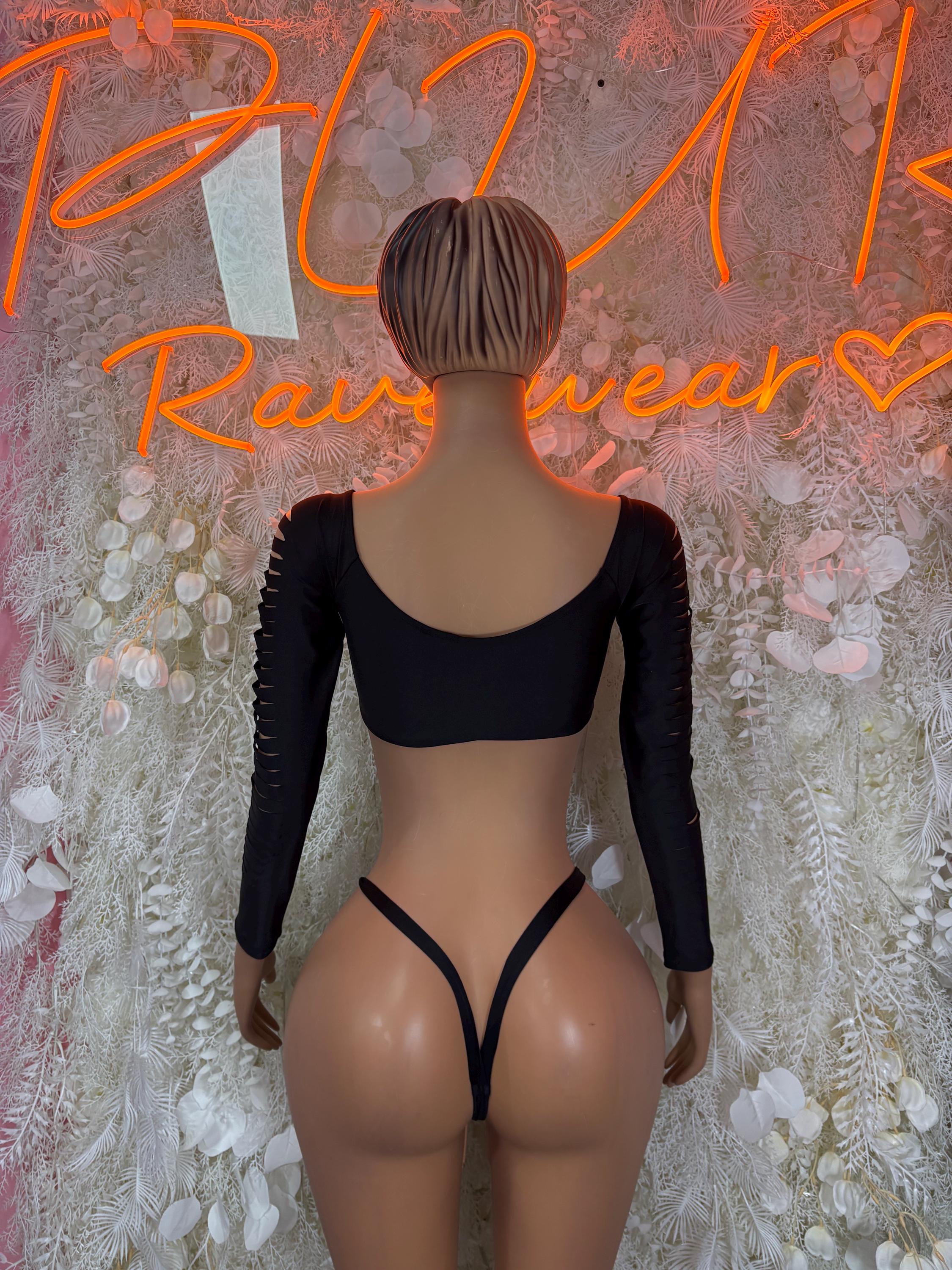 Black two-piece set with long-sleeve crop top and high-cut thong bottoms, back view