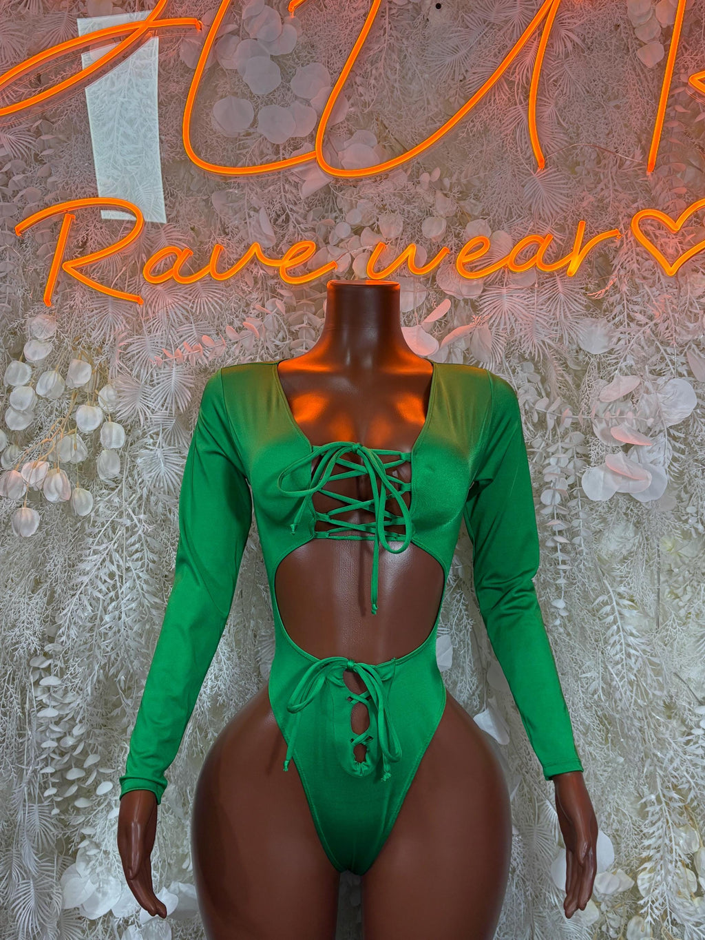 Green long-sleeve bodysuit with lace-up front, cheeky back and button detail