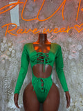 Green long-sleeve bodysuit with lace-up front, cheeky back and button detail