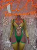 Green bodysuit with long olive sleeves, lace-up neckline, and matching green shorts