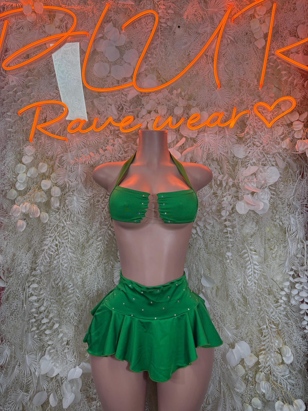 Green ruffle skirt set with halter top, on mannequin front