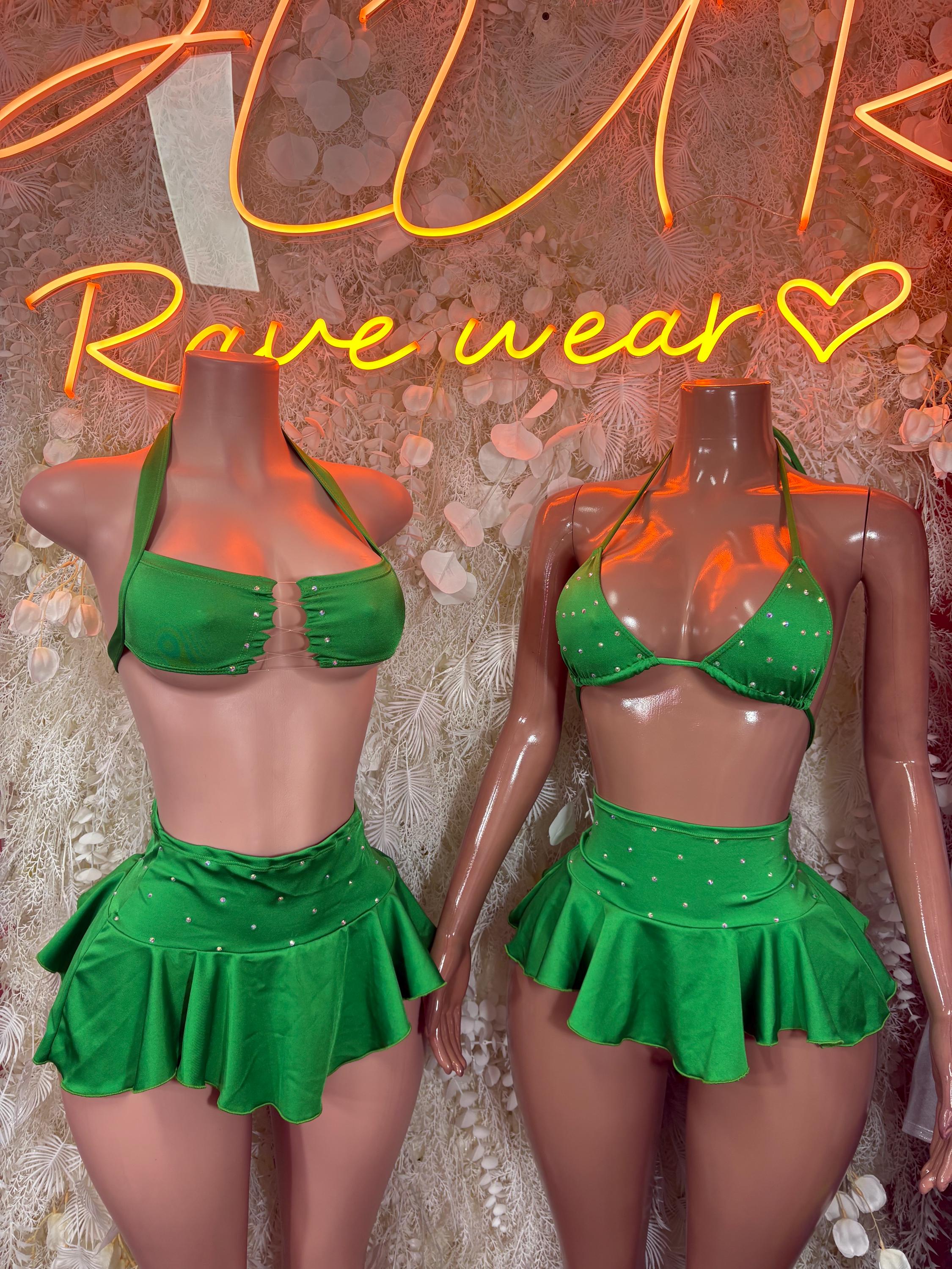 Two green ruffle skirt sets with halter tops, mannequins side by side