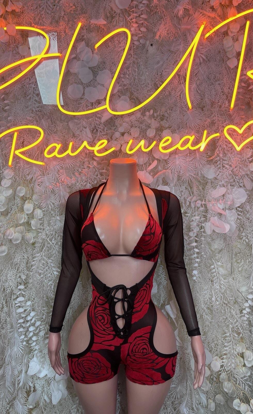 Black sheer long-sleeve bodysuit with red rose print and lace-up front
