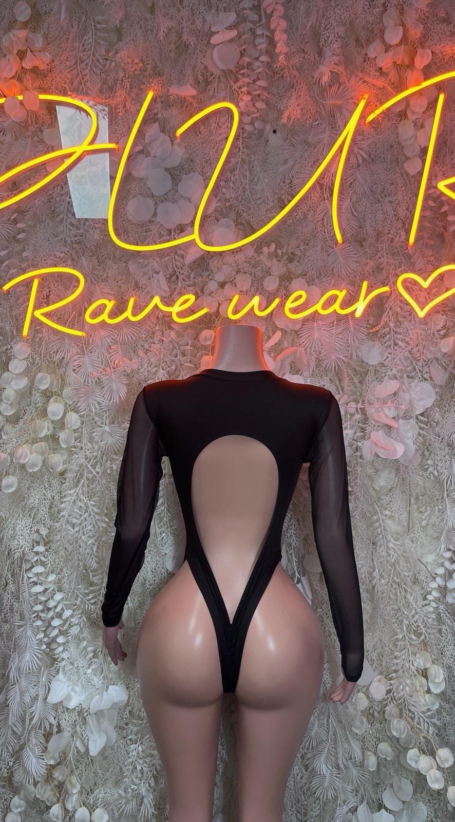 Black sheer long-sleeve bodysuit with open back V straps and minimal back coverage