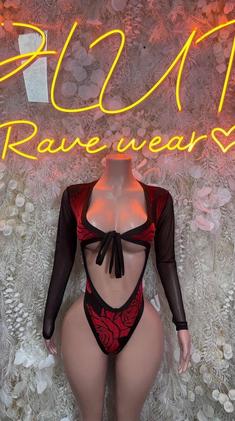Black sheer long-sleeve bodysuit with deep V neckline and red rose-pattern front detail