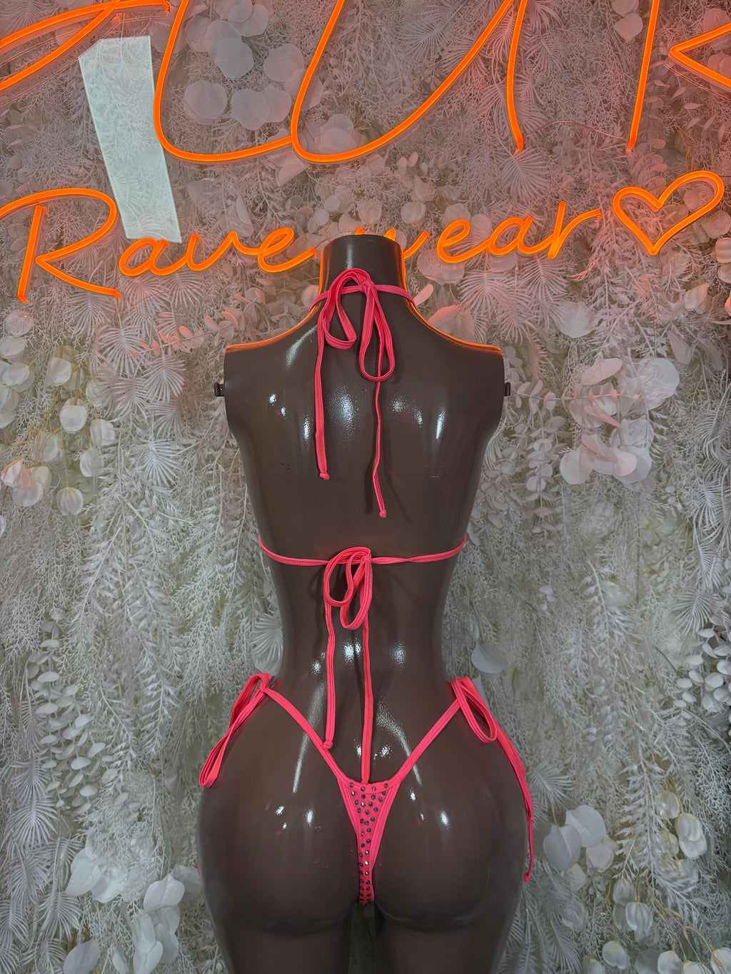 Coral rhinestone string bikini set back view with bow ties and V-shape bikini bottoms