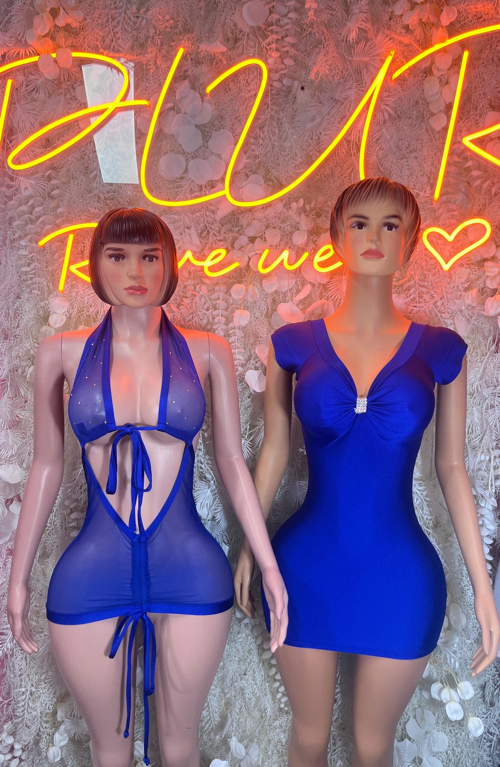 Blue clubwear outfits, one zip-front mini dress and one tied halter mini set