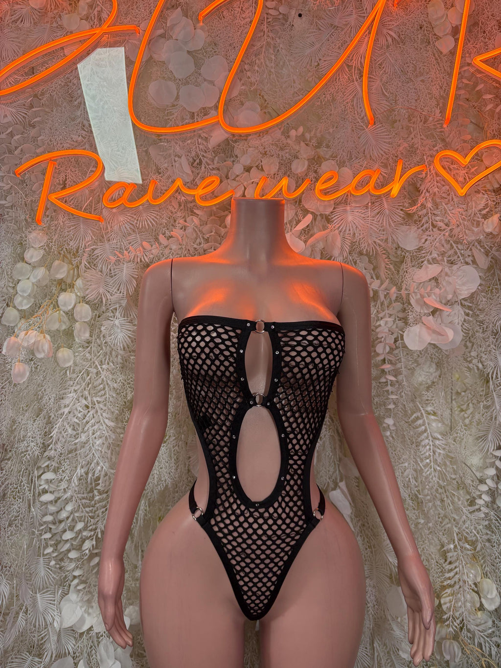 Black fishnet festival bodysuit with high-cut legs and oval front cutout